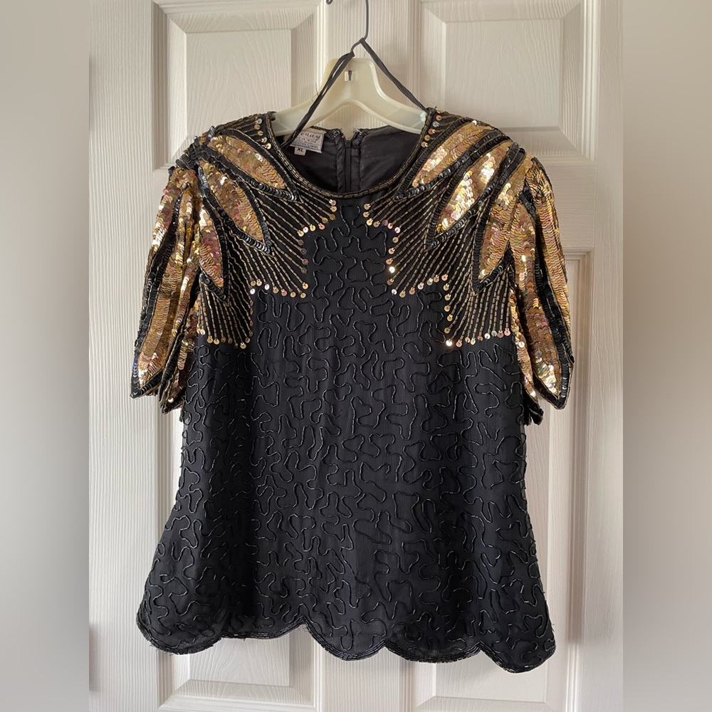 Short sleeve black top trimmed in gold